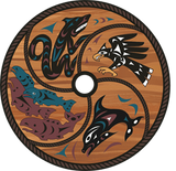 A circular carved wooden plaque featuring stylized Indigenous artwork of a wolf, eagle, fish, and totem poles in black, white, blue, and brown tones, shown on a plain white background. on Mayne Island British Columbia